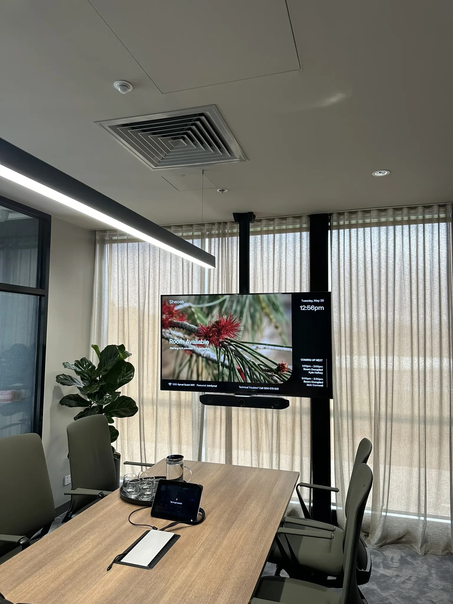 Sheer curtains and screen roller blinds supplied and installed for a commercial office fitout, combining glare reduction with a professional, polished appearance throughout the workspace.