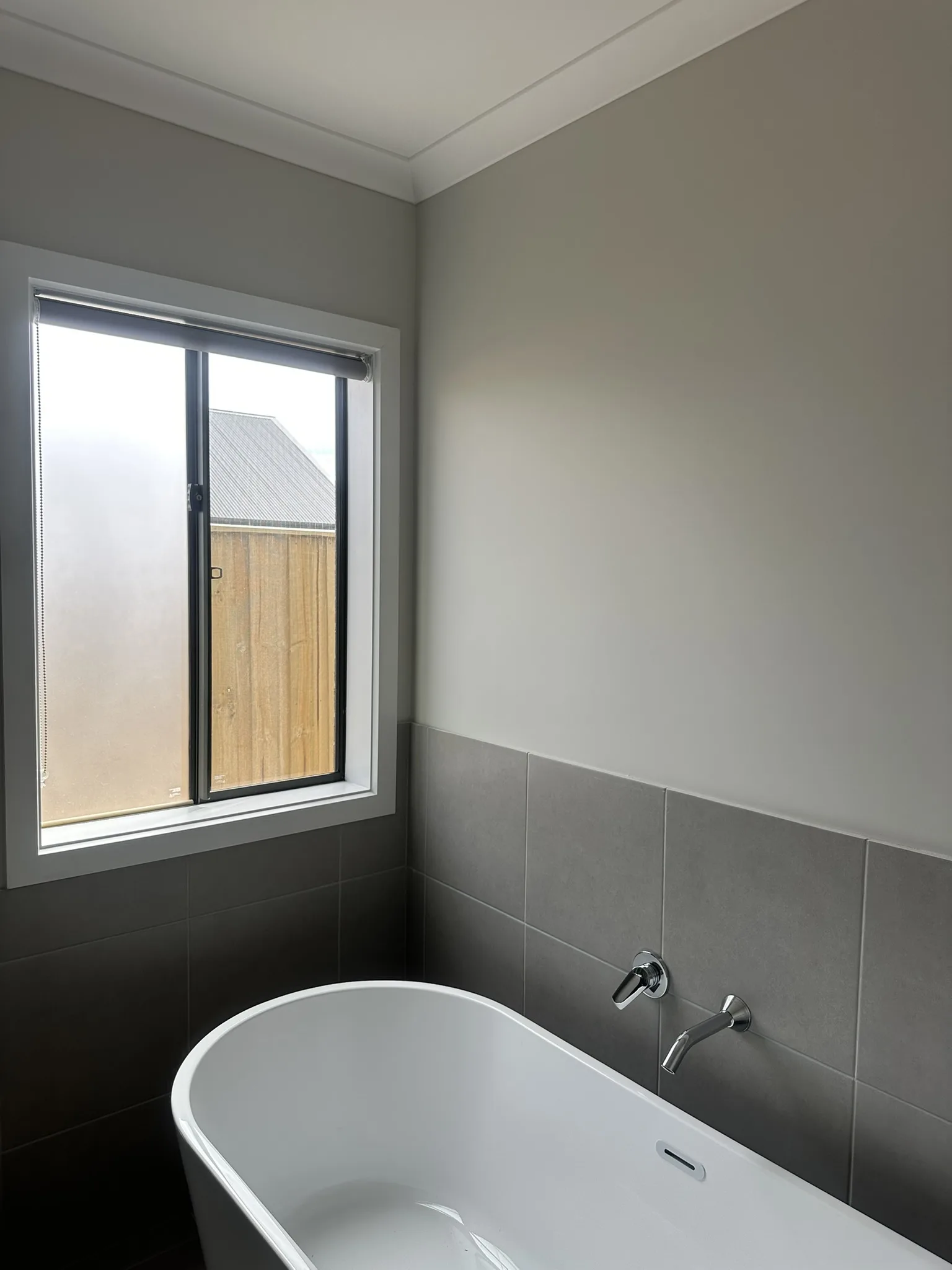Frosted privacy film installed to new build bathroom windows, giving full privacy while keeping the space bright, clean and modern.