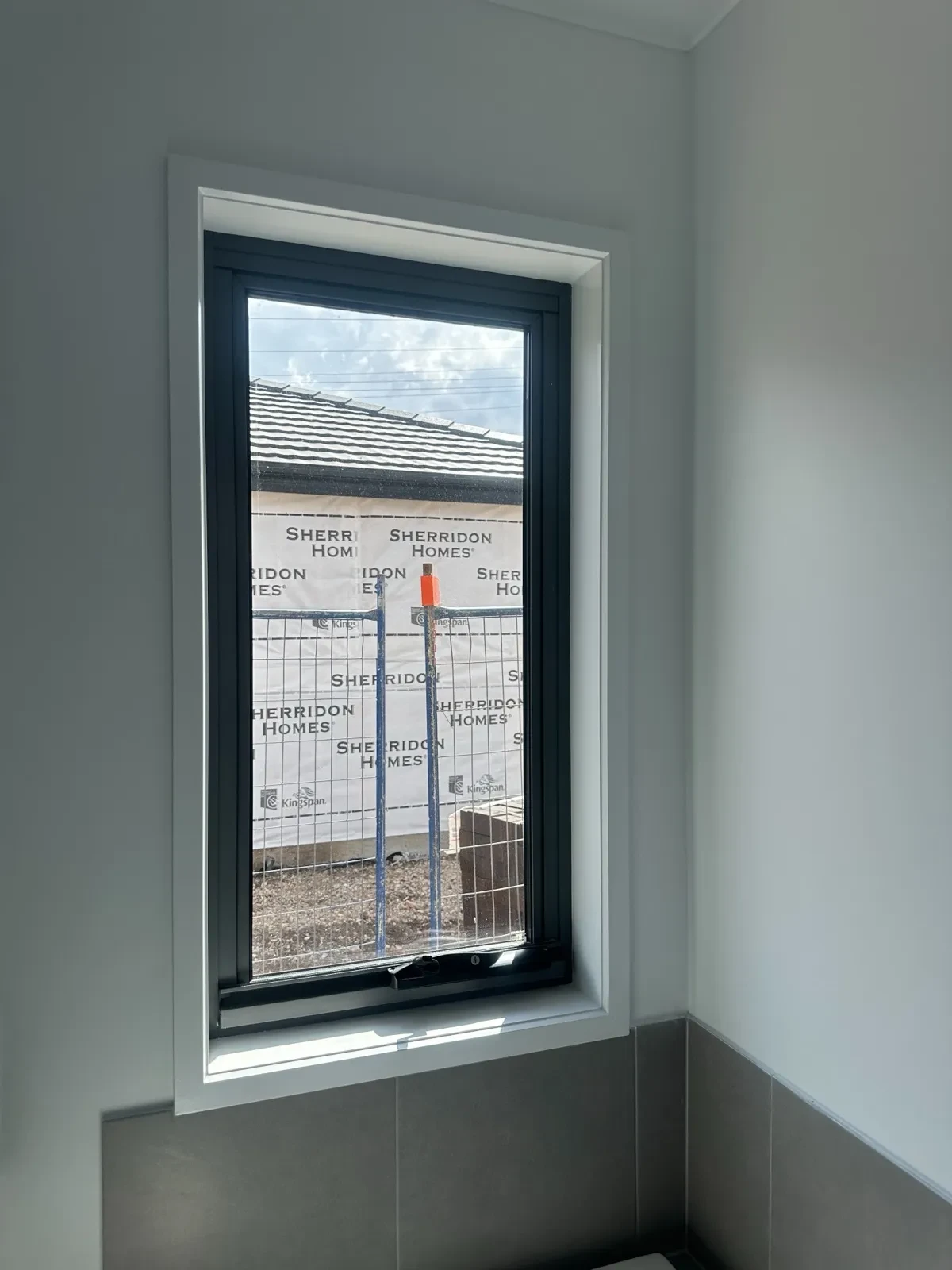 Privacy film on bathroom windows in a new Melbourne build