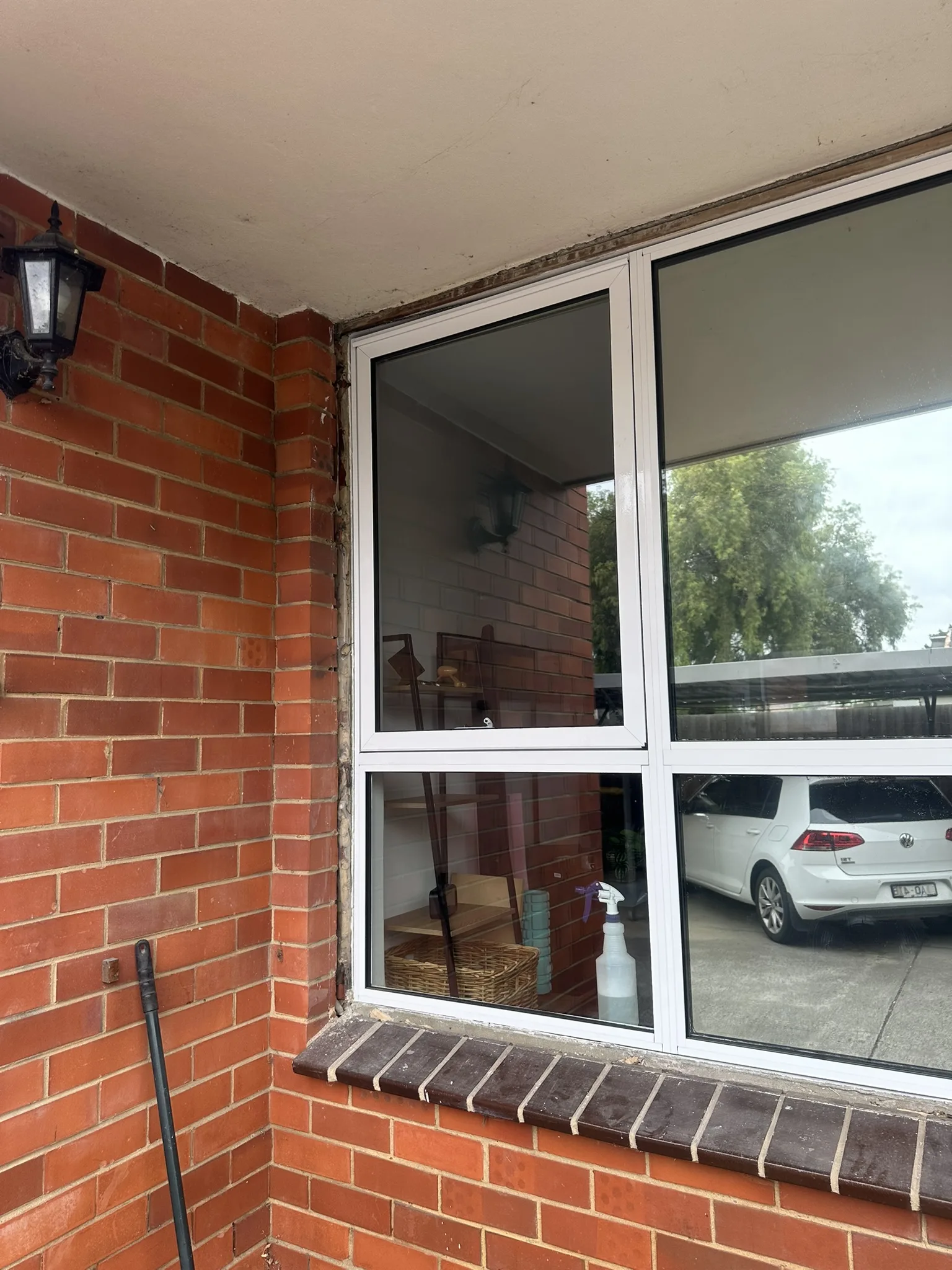 Dark mirror privacy film on apartment windows in Maribyrnong